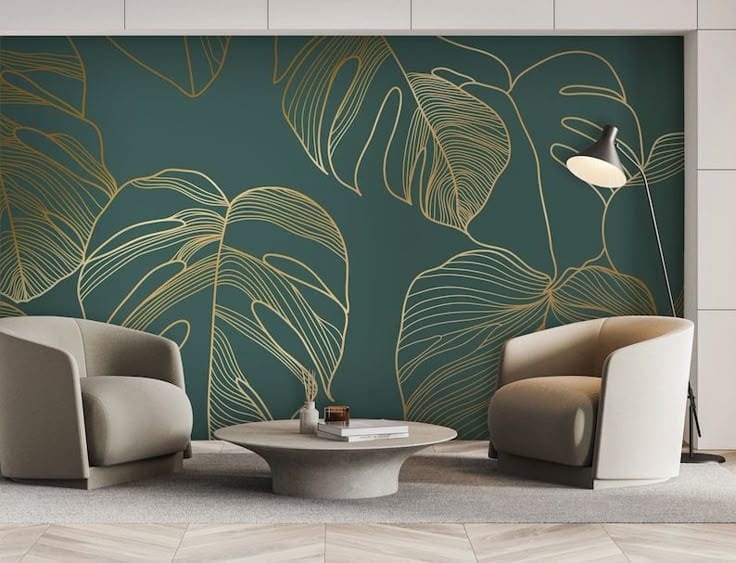 Living room with modern furniture including a gray armchair, a blue armchair, a sofa, and a round glass coffee table on a rug in a bright room with white paneled walls and large window